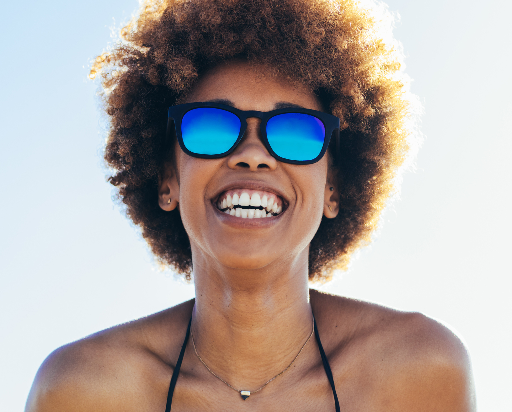 Beautiful woman at the beach on a sunny day